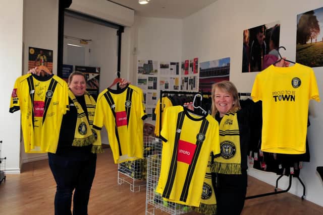 Katie McRae and Claire Kontominas in the Harrogate Town FC pop-up shop.
