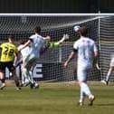 Josh McPake curls home Harrogate Town's late winner against Bradford City. Pictures: Jonathan Gawthorpe