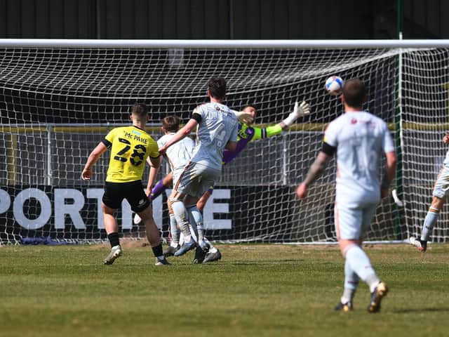 Josh McPake curls home Harrogate Town's late winner against Bradford City. Pictures: Jonathan Gawthorpe