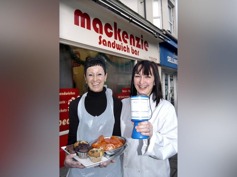 Owner of Mackenzie’s Ann-Marie McNeilly and Sharon Emanuel with a hospice collecting tin.