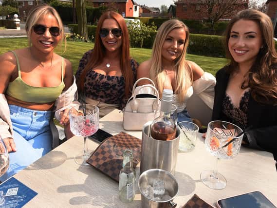 Drinkers at Albert's in Standish enjoy the sun