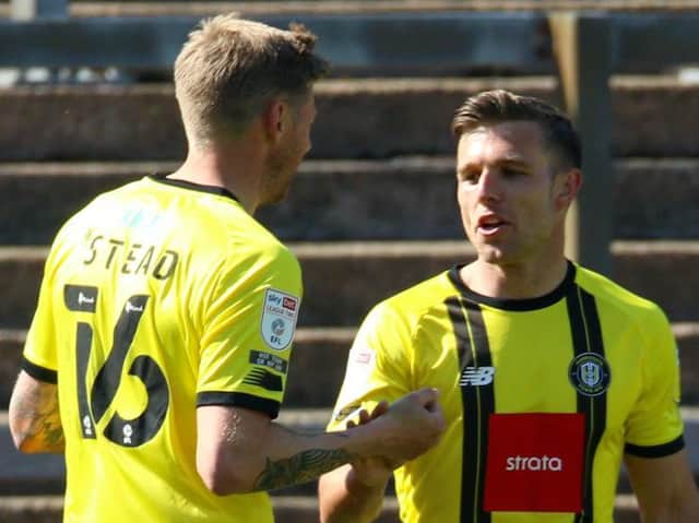 Harrogate Town's Jack Muldoon celebrates his goal against Carlisle United with strike partner Jon Stead. Pictures: Matt Kirkham
