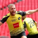 George Thomson celebrates after firing Harrogate Town into an early lead during August's 2019/20 National League play-off final triumph over at Notts County at Wembley Stadium. Picture: Getty Images