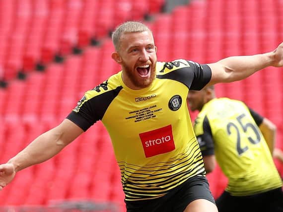 George Thomson celebrates after firing Harrogate Town into an early lead during August's 2019/20 National League play-off final triumph over at Notts County at Wembley Stadium. Picture: Getty Images