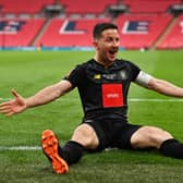 Harrogate Town captain Josh Falkingham celebrates after netting the winner against Concord Rangers at Wembley in the FA Trophy this afternoon. Picture: Getty Images.