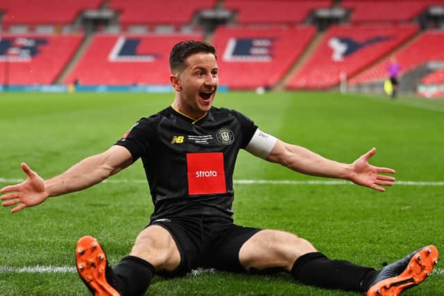 Harrogate Town captain Josh Falkingham celebrates after netting the winner against Concord Rangers at Wembley in the FA Trophy this afternoon. Picture: Getty Images.