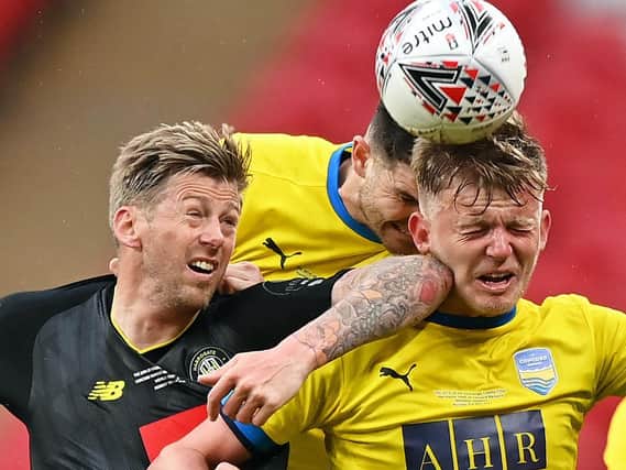 Harrogate Town striker Jon Stead competes for the ball with two Concord Rangers defenders. Pictures: Getty Images