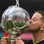 Harrogate Town captain Josh Falkingham with the FA Trophy. Pictures: Getty Images