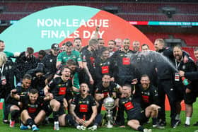 Wembley heroes: The victorious Harrogate Town team with the FA Trophy on Monday.