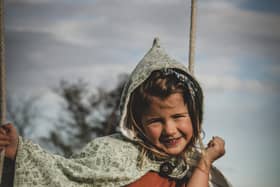 Charlotte’s daughter Isla showing off her pixie-style cape .