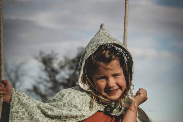 Charlotte’s daughter Isla showing off her pixie-style cape .