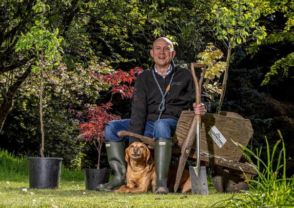 Dalton-based Inspired Pet Nutrition (IPN) has committed to planting one million trees across the UK. Pictured: CEO James Lawson and his dog Barney planting trees at Thorp Perrow Arboretum. PHOTO: Charlotte Graham.