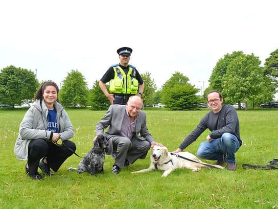 Concern over pets theft - North Yorkshire’s Police, Fire and Crime Commissioner  Philip Allott, pictured centre,  meeting dog owners on The Stray in Harrogate to discuss their worries.