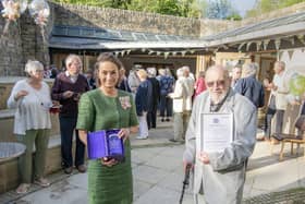 Lord Lieutenant for North Yorkshire, Jo Ropner presents 98 year old volunteer Cyril Wilkinson the Queen's Award for Voluntary Service to the Washburn Heritage Centre,  the highest award given to local volunteer groups across the UK. Cyril bakes flapjack and makes coleslaw for the tearoom.  Picture Tony Johnson