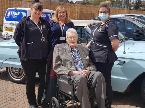 Staff members Lynsey, Hannah and Louise at The Cuttings care home in Harrogate with resident Richard Whitfield and the fabulous vintage car.