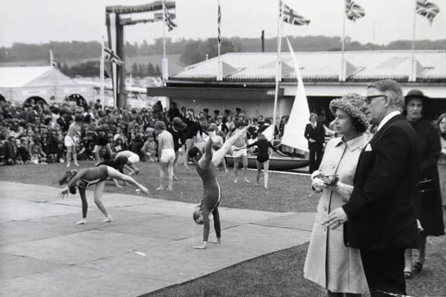 The Queen, accompanied by County Coun. C.P Blythe, chairman of the North Yorkshire Education Comittee, watches gynastics in the 'Growing up in North Yorkshire' display. July 14th 1977.