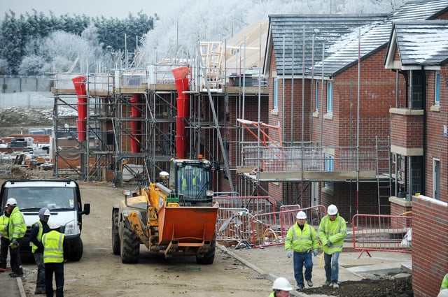 17th January 2013. At home in Cross Gates. Bellway Homes Ltd development The Limes, Manston Lane, Cross Gates. Home building construction workers on site.