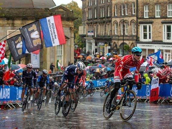 Flashback to 2019 - The Elite Men Road Race peloton passes the Royal Pump Rooms to climb Cornwall Road in Harrogate during in the UCI World Championships.