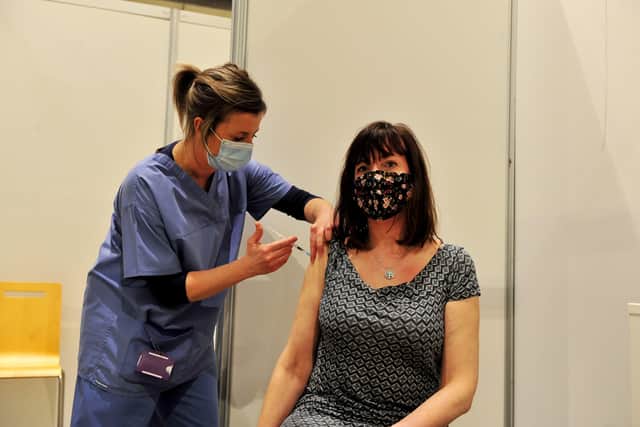 23rd February 2021
Harrogate Vaccination Centre feature
Pictured nurse Lizzie Teggin gives a vaccination to Kirsty Matthews from Harrogate
Picture Gerard Binks