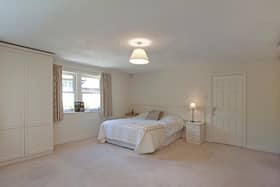 The principal bedroom with built in wardrobes and en-suite bathroom.