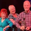 Howard Atkin (Woodlands Drama Group) being presented with the Best Actor Trophy.