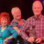 Howard Atkin (Woodlands Drama Group) being presented with the Best Actor Trophy.