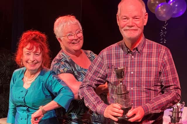 Howard Atkin (Woodlands Drama Group) being presented with the Best Actor Trophy.