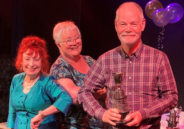 Howard Atkin (Woodlands Drama Group) being presented with the Best Actor Trophy.