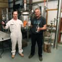 Arable farmer Dave Rawlings, who produces Priory Vodka, on his farm near Tadcaster. Pictured with head distiller Ireneusz Olszewski. Priory Vodka will be on sale at the artisan market in Tadcaster this week. Picture Jonathan Gawthorpe .