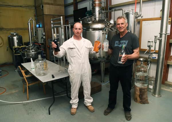 Arable farmer Dave Rawlings, who produces Priory Vodka, on his farm near Tadcaster. Pictured with head distiller Ireneusz Olszewski. Priory Vodka will be on sale at the artisan market in Tadcaster this week. Picture Jonathan Gawthorpe .