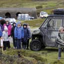 Game keeper Dan Place talk with 9-year-old Eddie Harrison of Hackforth and Hornby School at the 'Let's Learn Moor' event near Grinton on the Yorkshire Moors.