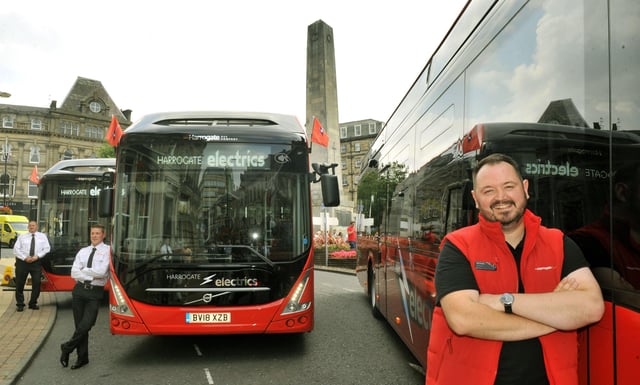 Alex Hornby Chief Executive of Transdev with some of the new electric buses to be used around Harrogate on show in the town.