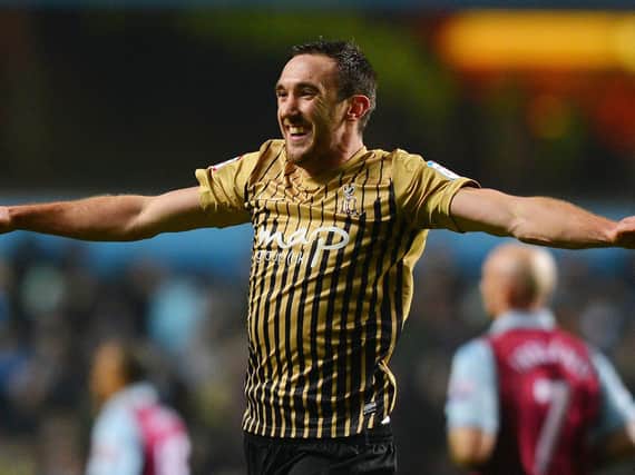 Rory McArdle celebrates Bradford City's 2013 League Cup giant-killing of Aston Villa. Pictures: Getty Images