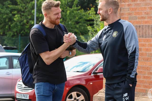 Mark Oxley is greeted by new boss Simon Weaver upon his arrival at Harrogate Town's training ground for the first day of pre-season.