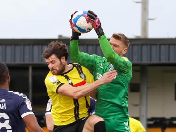Mark Oxley climbs highest to beat Connor Hall to the ball during Southend United's League Two victory over Harrogate Town on March 27. Pictures: Matt Kirkham