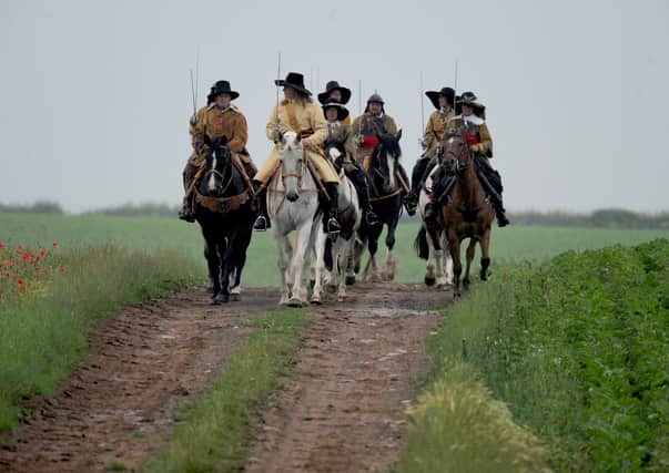 3rd July 2021
Equistry and The Troop bring history to life as they commemorate the 377 th
anniversary of the Battle of Marston Moor. At noon, they will be giving a brief historical talk outside
the Boot and Shoe Inn, Tockwith before riding to the battlefield and memorial. This charity ride is
supporting Brooke, an international charity that protects and improves the lives of horses, donkeys
and mules which give people in the developing world the opportunity to work their way out of
poverty.
Pictured the group on the battlefield at Marsden Moor.
Picture Gerard Binks