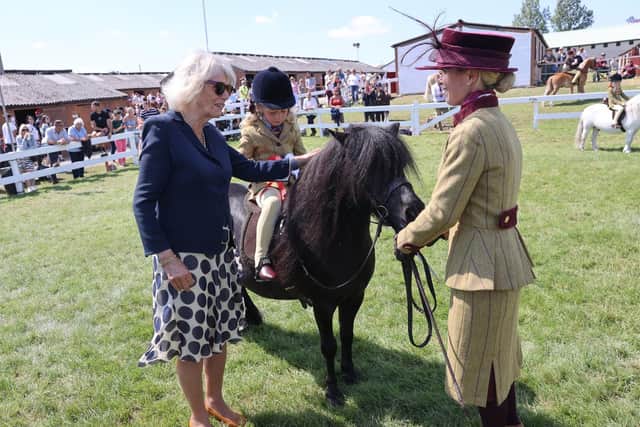 The Duchess of Cornwall speaks to a mother as her daughter rides a pony during a visit to the Great Yorkshire Show. Image: Chris Jackson/PA Wire