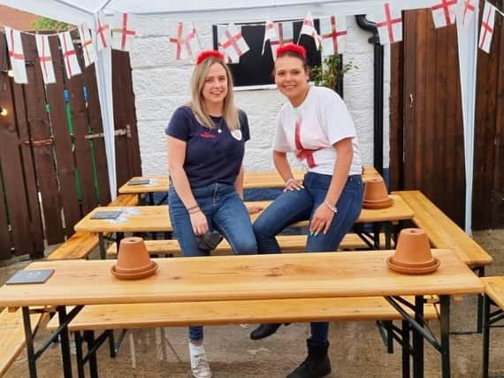 C'mon England - Harrogate bar The Tap at Tower Street staff members Caitlin Labonte and Sophie McGeever before the England v Italy match.