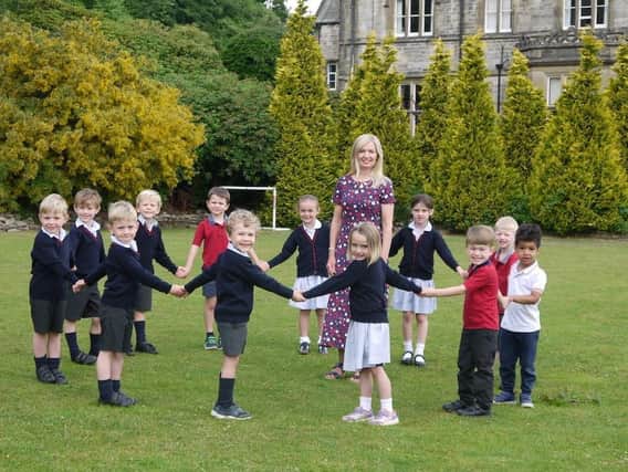Happy retirement - Nursery teacher Ann Regan says farewell to pupils at Belmont Grosvenor School in Harrogate after 25 years of caring for hundreds of children.