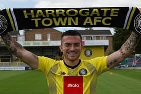 Lewis Page signed for Harrogate Town after rejecting a new deal with League Two rivals Exeter City.