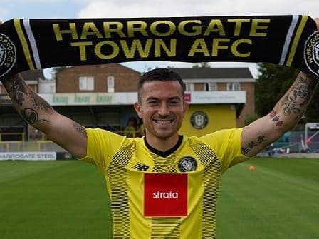 Lewis Page signed for Harrogate Town after rejecting a new deal with League Two rivals Exeter City.
