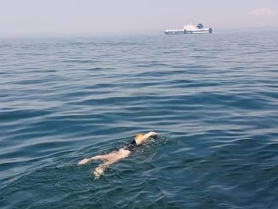 English Channel success - The Harrogate team pictured swimming in one of the busiest shipping lanes in the world.