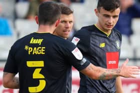 Simon Power, right, is congratulated after firing Harrogate Town into an early lead against Darlington at Blackwell Meadows. Pictures: Matt Kirkham