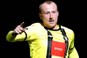 Mark Beck celebrates after scoring the opening goal during Harrogate Town's 3-0 League Two success over Colchester United. Picture: Getty Images