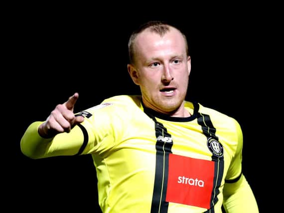 Mark Beck celebrates after scoring the opening goal during Harrogate Town's 3-0 League Two success over Colchester United. Picture: Getty Images