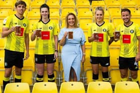 Cheers to sponsorship - Charlene Lyons, Chief Executive of Black Sheep Brewery, with Harrogate Town AFC players.