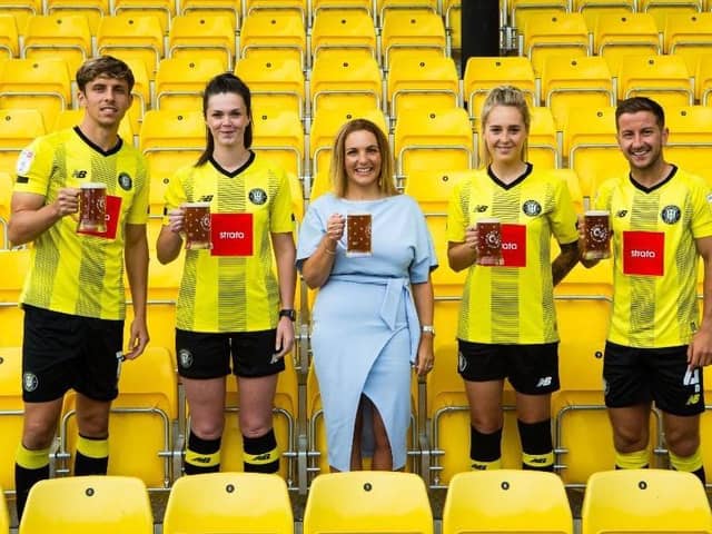 Cheers to sponsorship - Charlene Lyons, Chief Executive of Black Sheep Brewery, with Harrogate Town AFC players.