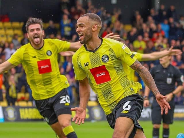 Harrogate Town defender Warren Burrell celebrates his late winner against Rochdale. Picture: Matt Kirkham