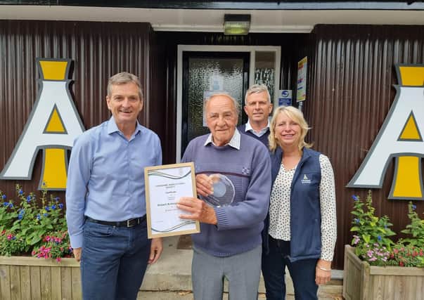 Tony Morris, a salesman who is retiring after 60 years with Masham-based animal feed producer I'Anson Brothers, is congratulted for his long service by chairman and managing director Chris I'Anson, sales director Will I'Anson and sales manager Sarah Richardson.