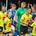 Harrogate Town players take the field ahead of Saturday's opening-day victory over Rochdale at the EnviroVent Stadium. Pictures: Matt Kirkham